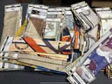 a lot of different types of ties on a table
