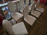many chairs that are lined up on the wooden floor