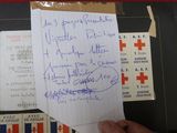 a person holding a piece of paper with a lot of writing on it