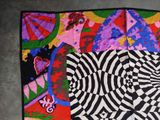 a black and white picture of a multicolored scarf