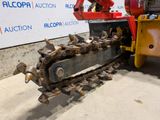 a picture of a tractor with a chain attached to it ' s back