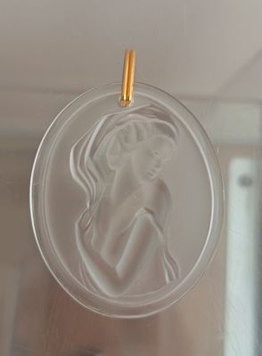 a glass ornament with a picture of a woman on it