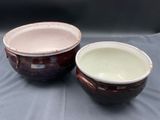 two bowls that are sitting on a table