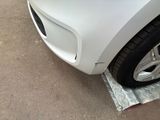 a close up of a car ' s front bumper