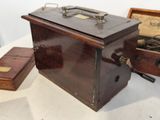 an old sewing machine sitting on a table next to a box