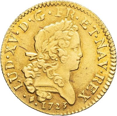 a gold coin with a woman ' s head and a crown on it