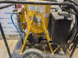 a machine that is sitting on a cart in a room