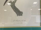 painting of a colorful bird sitting on a branch in a frame