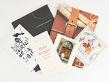 a lot of books that are laying on a table