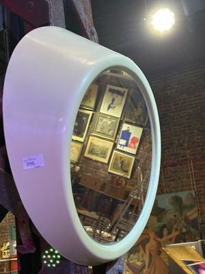 a mirror that is hanging on the wall in the room