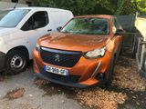 two cars parked next to each other on the side of the road