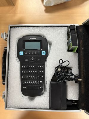 a black and blue label printer in a black case