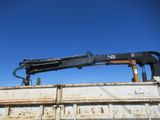 a crane that is sitting on the back of a truck