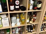 many bottles of alcohol on the shelves in the room