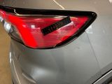 a close up of a car with a sticker on the back of it