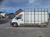 a picture of a white van parked in a parking lot