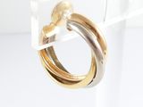 two tone gold and silver hoop earrings on clear acrylic stand