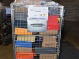 a metal cart with many boxes on it in a warehouse