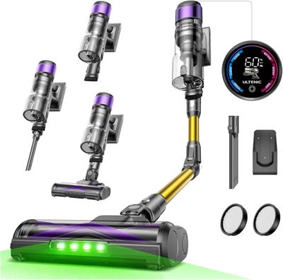 a close up of a vacuum cleaner with a green light on it