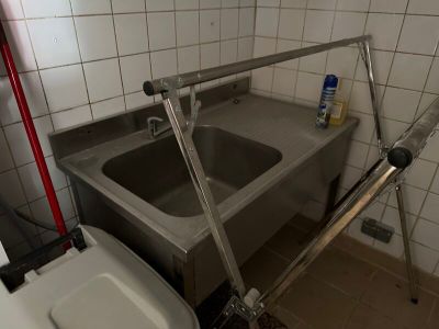 a bathroom with a sink and a toilet in it