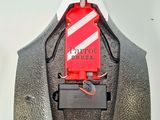 an image of a close up of a suit with a tag attached to it