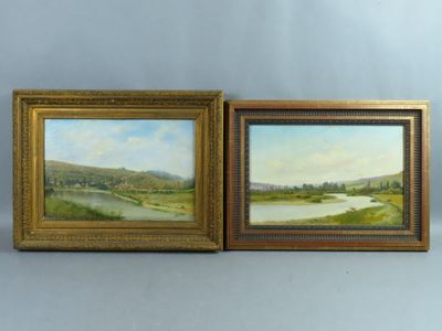 two framed paintings of a river and a valley with trees