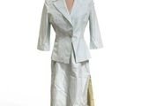 a dress and jacket on a mannequin on a stand