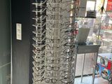 a large display of glasses in a store with a lot of glasses on it