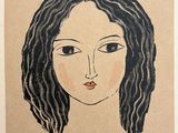 un dessin du visage d'une femme sur un morceau de papier