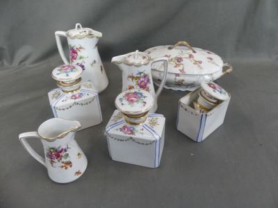 five pieces of porcelain tea and coffee set on a table