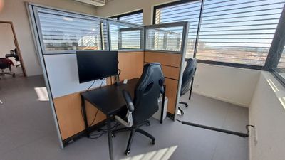 an image of an office cubicle with a view of the city