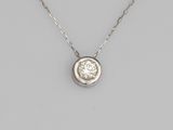 a diamond single - stone pendant on a chain