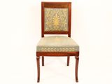 a wooden chair with a blue and green upholstered seat