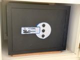 a black safe box that has a personal label on it