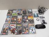 a lot of video games and a cell phone on the table