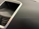 a close up of a car ' s dashboard with a vent vent