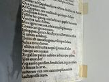 a piece of paper taped to the wall with writing on it