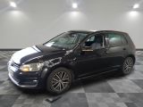 a picture of a black volkswagen golf in a showroom