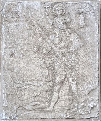 an image of a stone relief of a man with a staff
