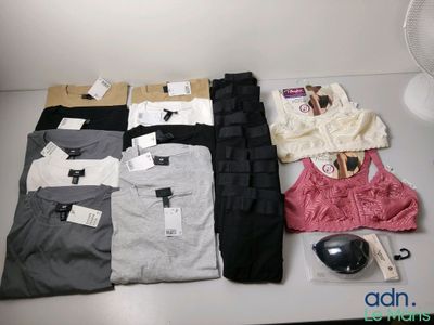 many different types of clothing on a table