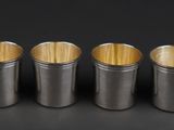 six different sizes of bamboo sticks in a row on a black background