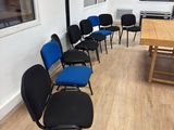 a room with chairs and a table in it