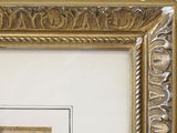 a picture of a gold frame with a picture of a man and a woman on it