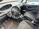 the interior of a car with a steering wheel and a dashboard