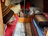 an image of a small boat with a bed and a couch