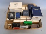 a lot of different types of perfumes in a box