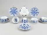 a group of blue and white china dishes and cups