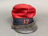 a red hat with the number 17 on it sitting on a table