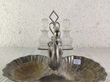 a silver plate with two bowls on it on a table