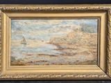 un tableau représentant un voilier sur l'eau, dans un cadre doré
